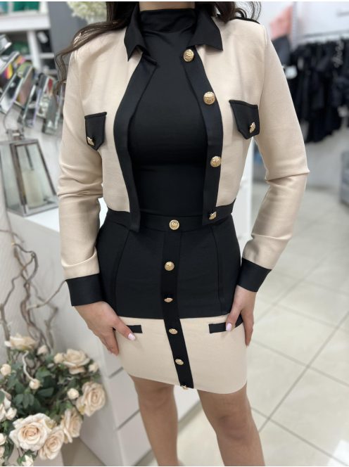 Rugalmas anyagú, prémium minőségű szett. Béleletlen, válltöméses, díszgombos blézer, hátul cipzáras szoknyával. A Modell S méretet visel. (S,M és L méretekben.)